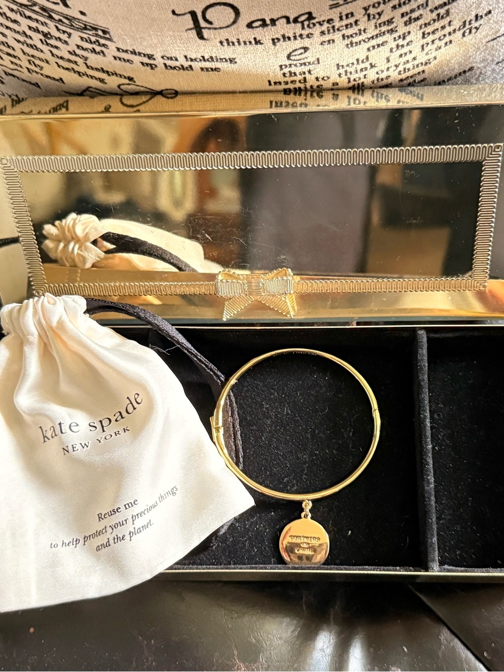 kate spade Partners in Crime gold round charm bangle bracelet